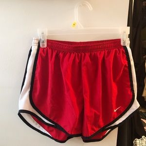Red and black nike athletic shorts